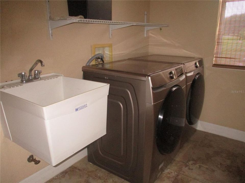 laundry room with utility sink