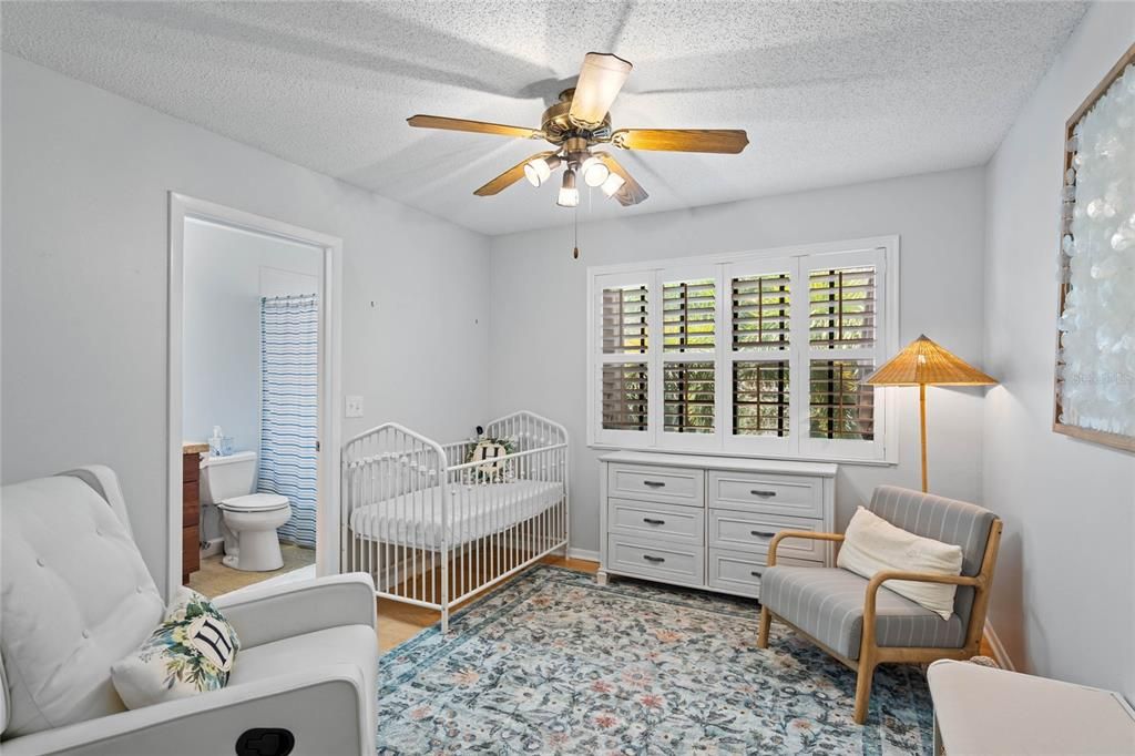 Guest bedroom upstairs with joined bathroom, currently serving as nursery