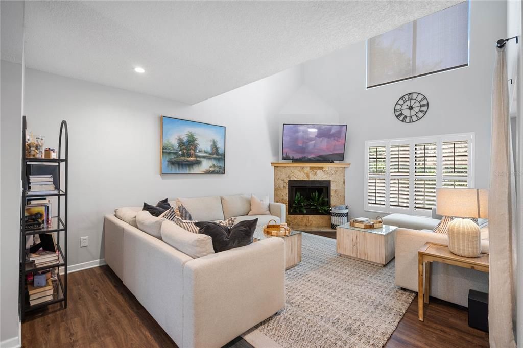 Lots of natural light in the living room with high ceilings that feel spacious