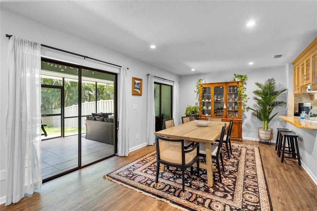 Dining room boasts double sliding glass doors to lanai