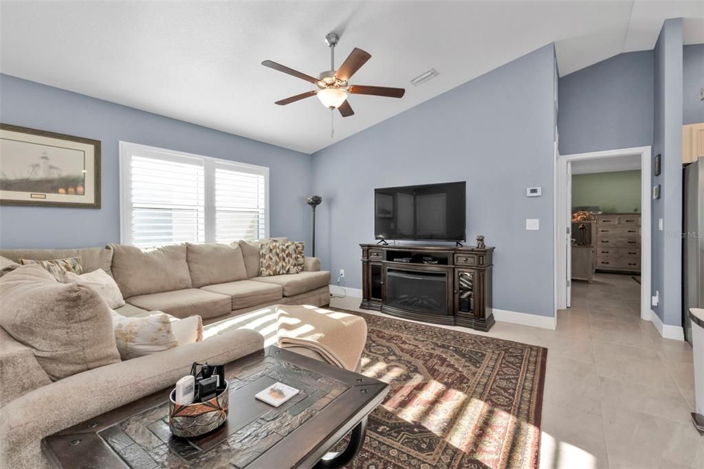 Living room opens to kitchen and dining area