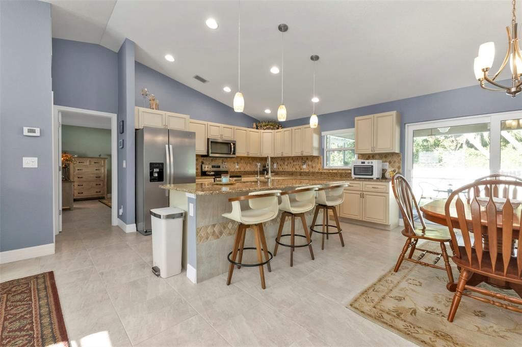 Kitchen is spacious with granite countertops, soft close cabinets and stainless steel appliances.