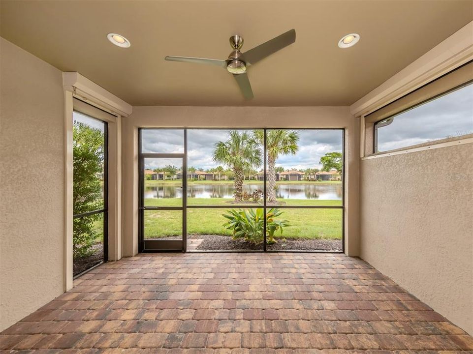 The screened in lanai also includes electric hurricane shutters