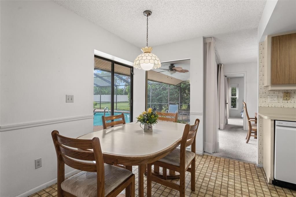 Eat-in kitchen with access to the pool