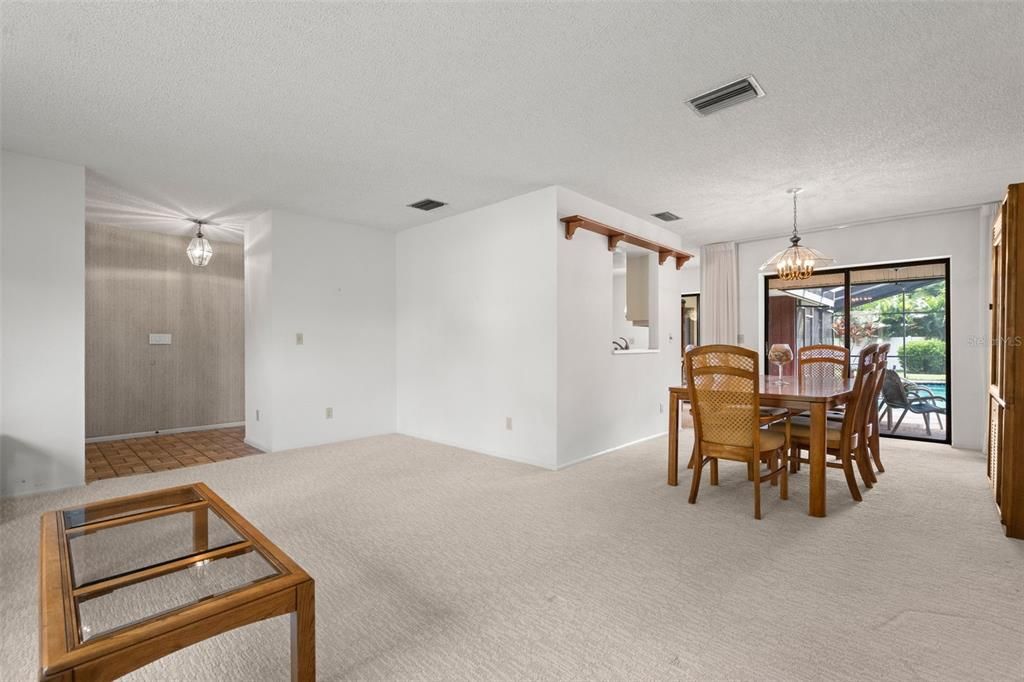 Family room and formal dining room with access to the pool