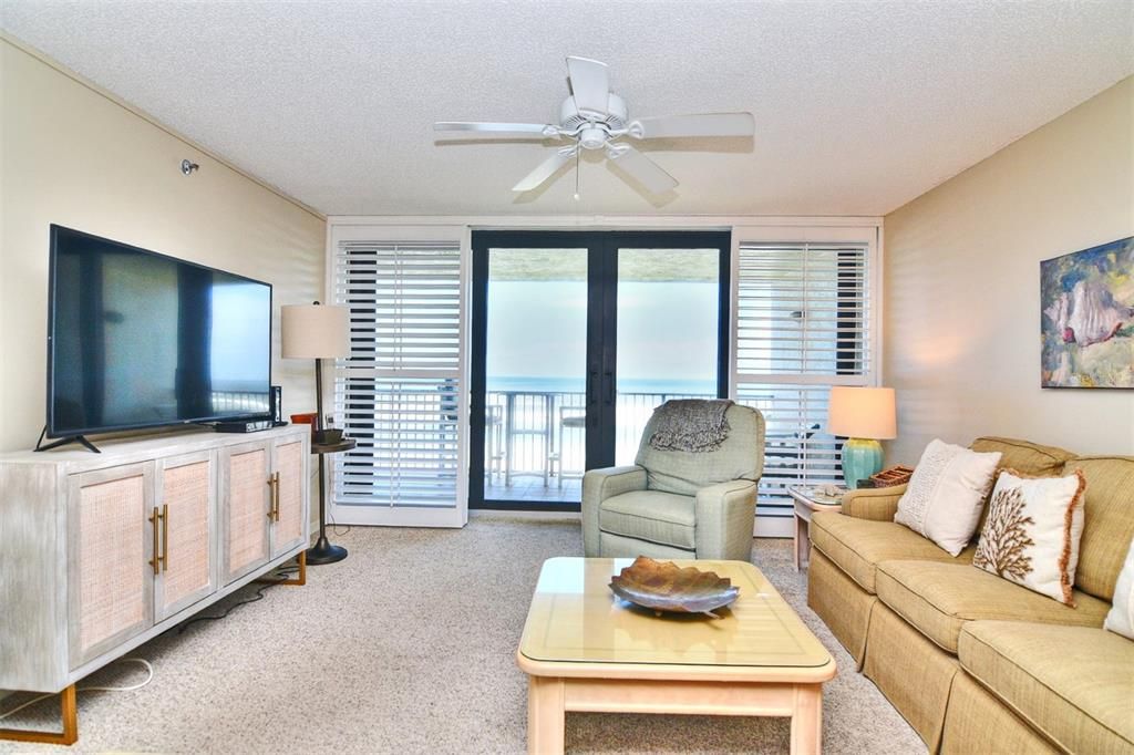 Living Room with Oceanfront Balcony in background Pic 2