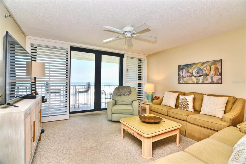 Living Room with Oceanfront Balcony in background Pic 1