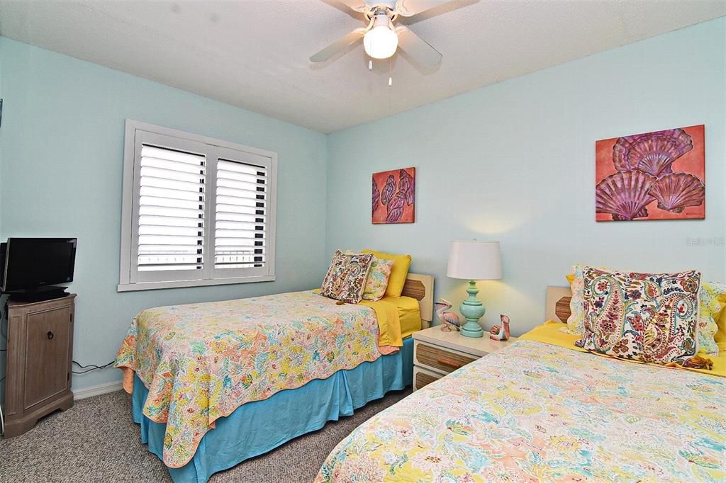 Bedroom 3 with Twin beds and views of  beautiful sunsets over the Indian River Lagoon.