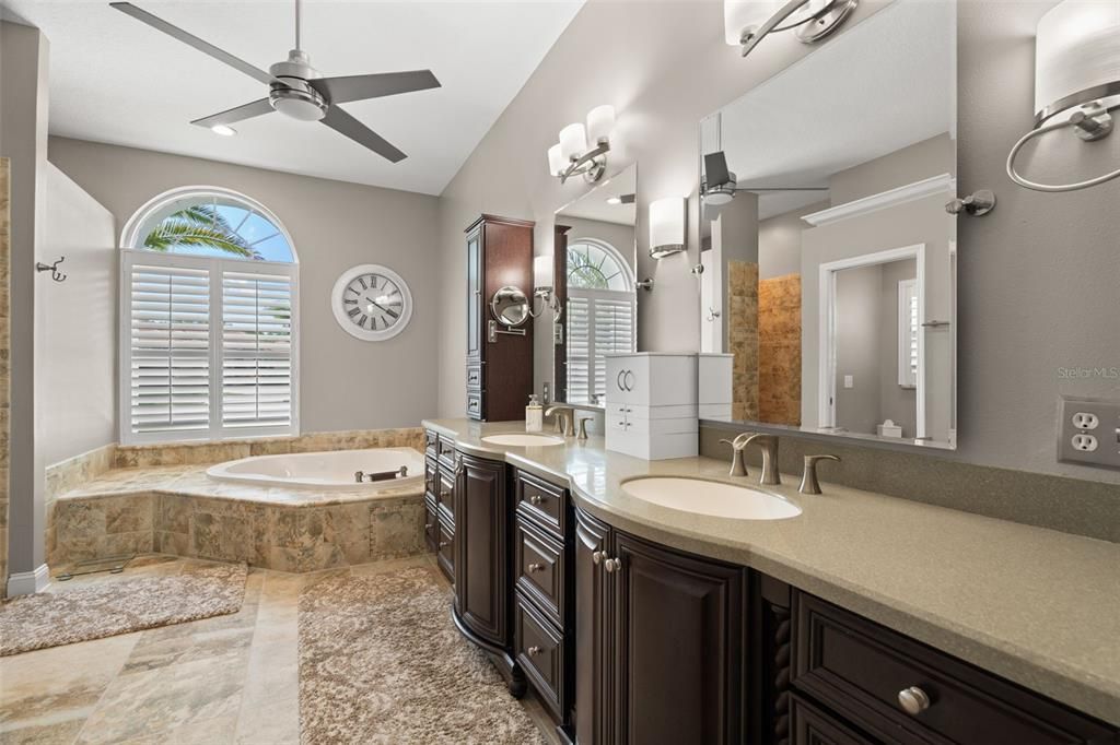 Primary bath with shower, garden tub, double sinks, and water closet.