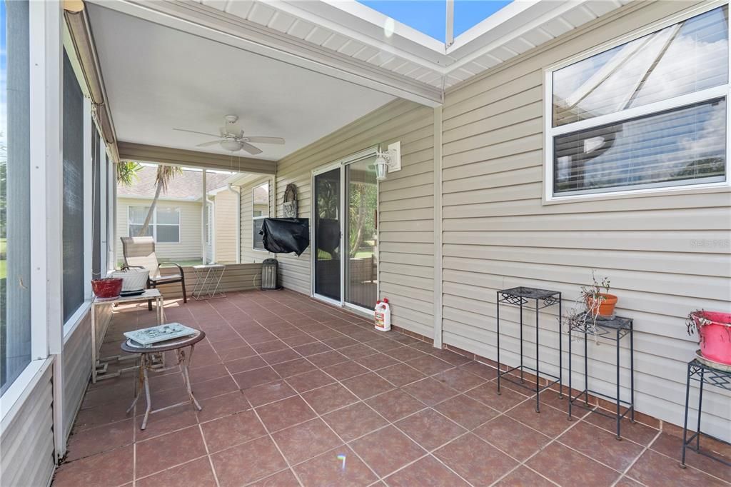 Covered Lanai with TV and Tile flooring