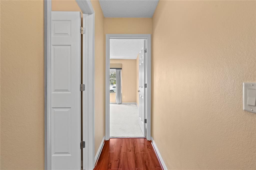 Hallway between 2nd and 3rd Bedroom with the 2nd Bathroom. Also has a pocket door for privacy.