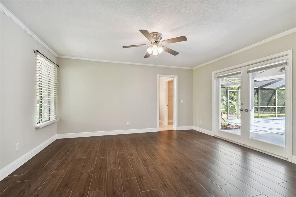 Bedroom 1 w/double doors to the pool area & en-suite bathroom