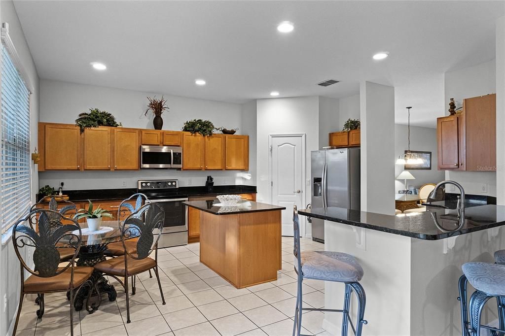 Open floor plan kitchen with stainless steel appliances