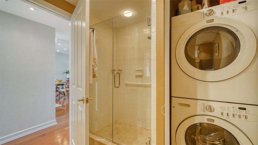 Stackable laundry in spare bathroom.