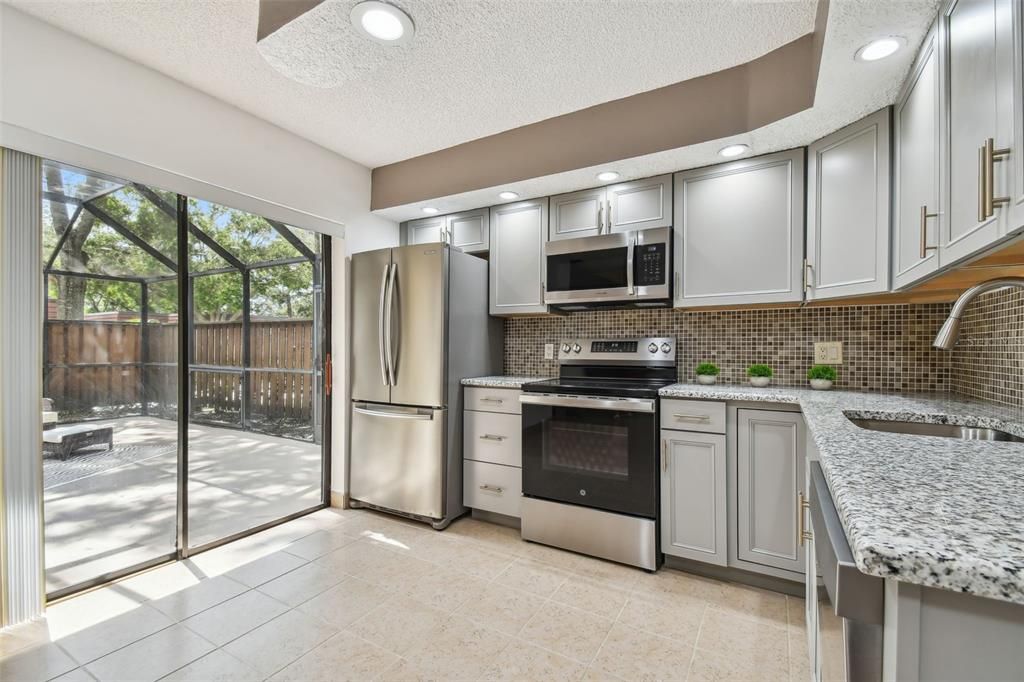 Kitchen has view of patio