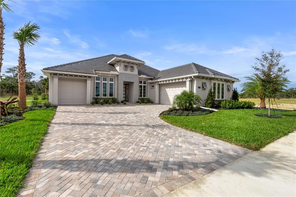 Pavers Driveway Leads to 3 Car Garage