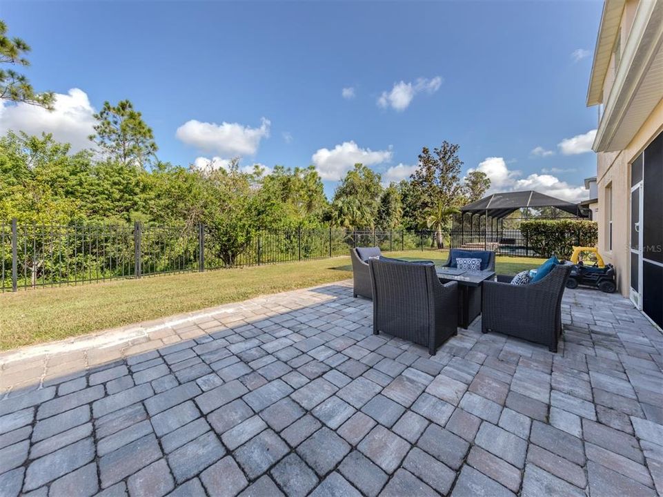 The paver lanai has been extended and perfect for entertaining guests or relaxing after a day at the pool