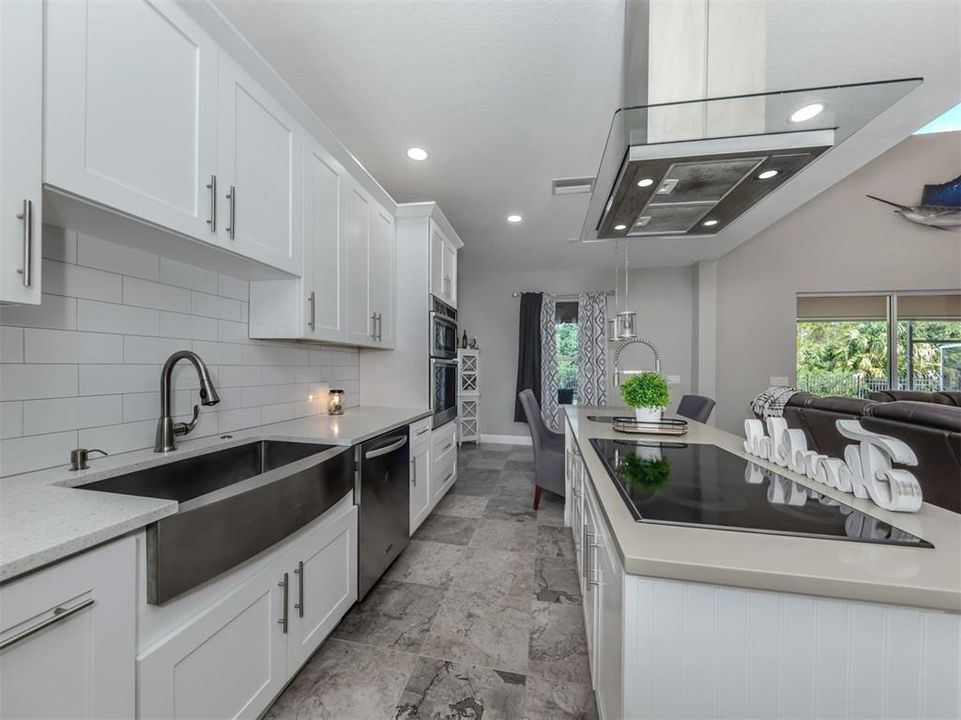 Newer stainless appliances with large farm sink and cook island with vent completes this kitchen!