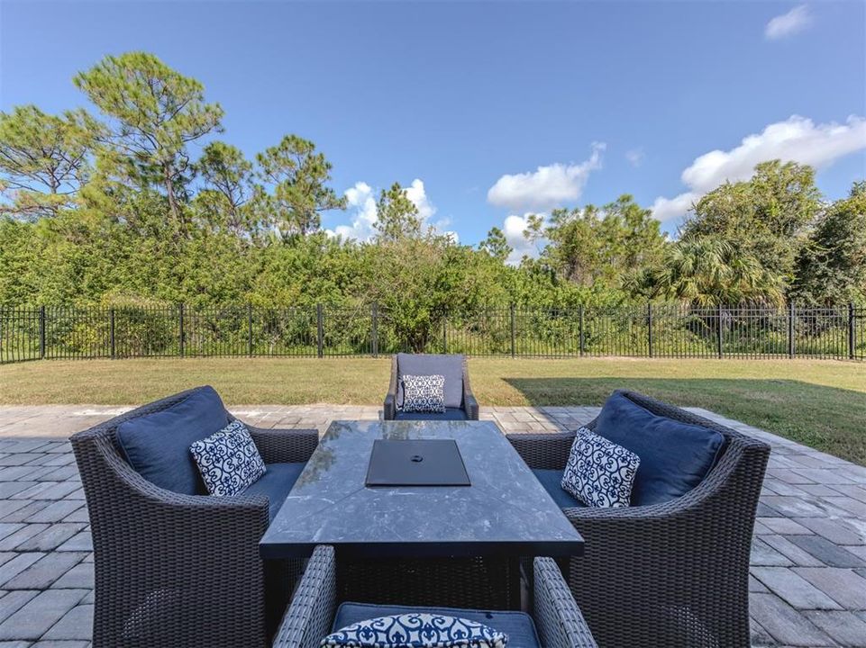 The extended lanai is the perfect place to enjoy a fire table and watch the stars