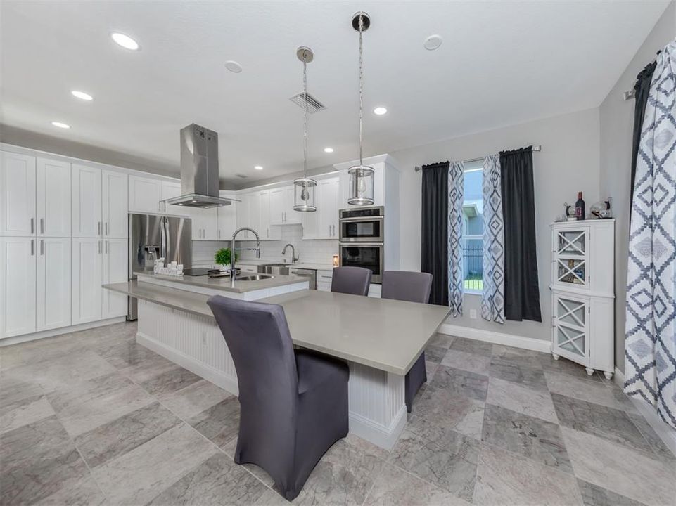 Lots of solid wood cabinetry, quarts countertops, wall ovens make meal time a breeze!