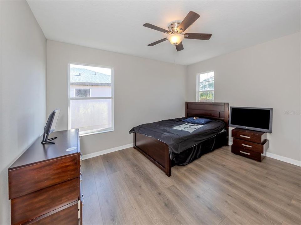 Bedroom two is large with a walk in closet and connected to a Jack and Jill bath