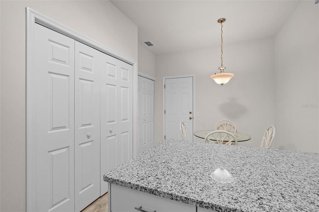 Kitchen - Dining area with pantry and laundry closet