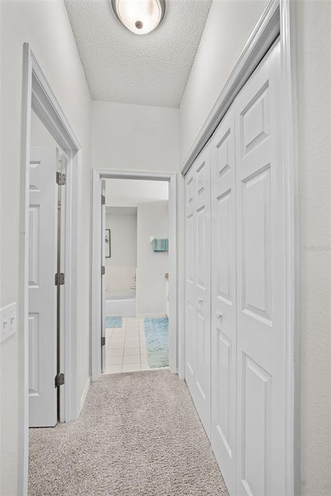 Primary Bathroom Hallway with closets