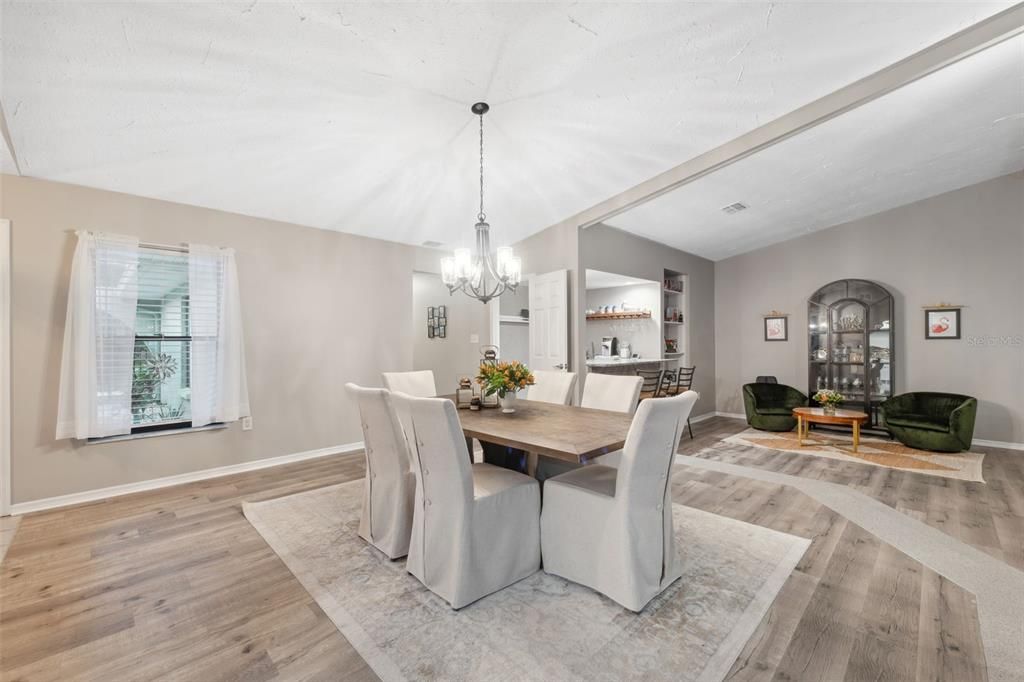 Formal Dining Room, step down to sitting room on right