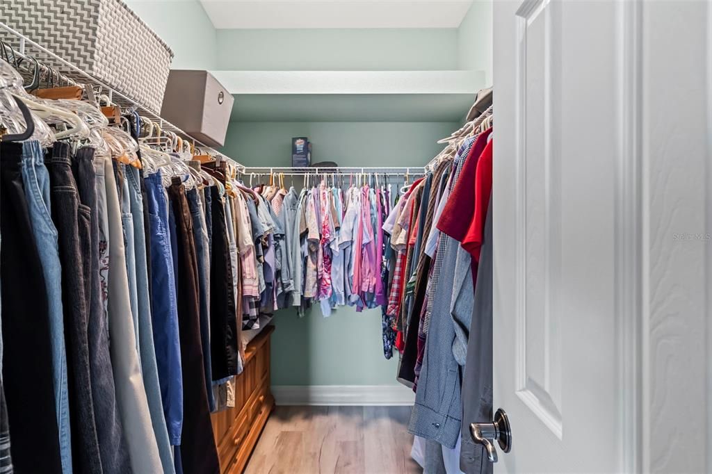 Primary bedroom walk in closet