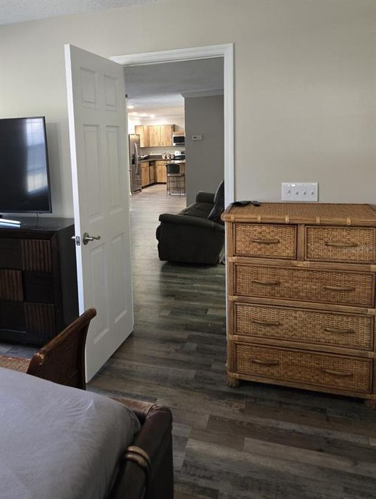 And Back Downstairs, the Master Bedroom Opening to the Living Rm and Kitchen