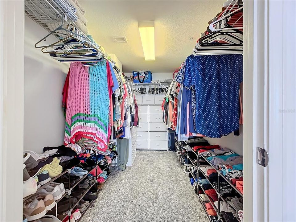 Primary Bedroom walk-in closet w/ built-ins