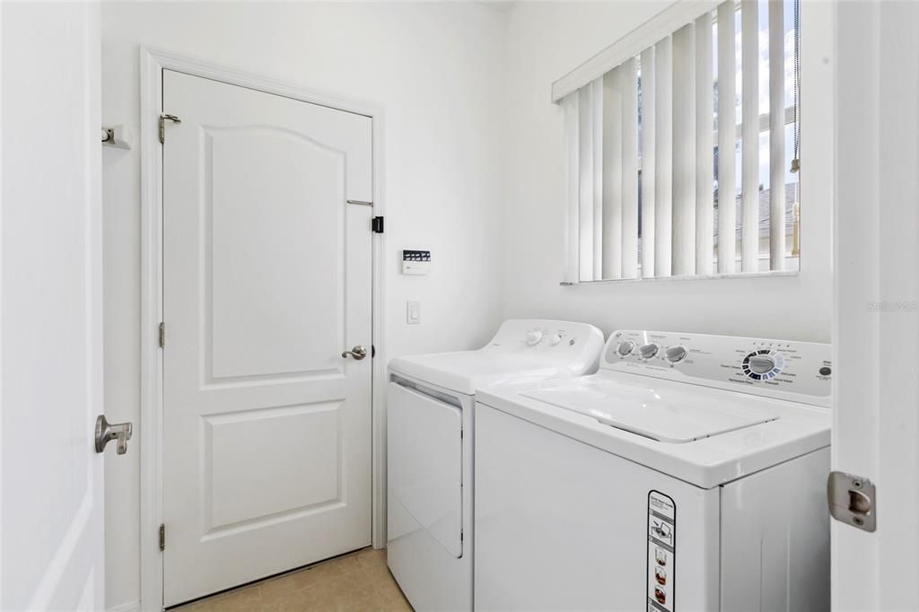 inside Laundry Room with shelving