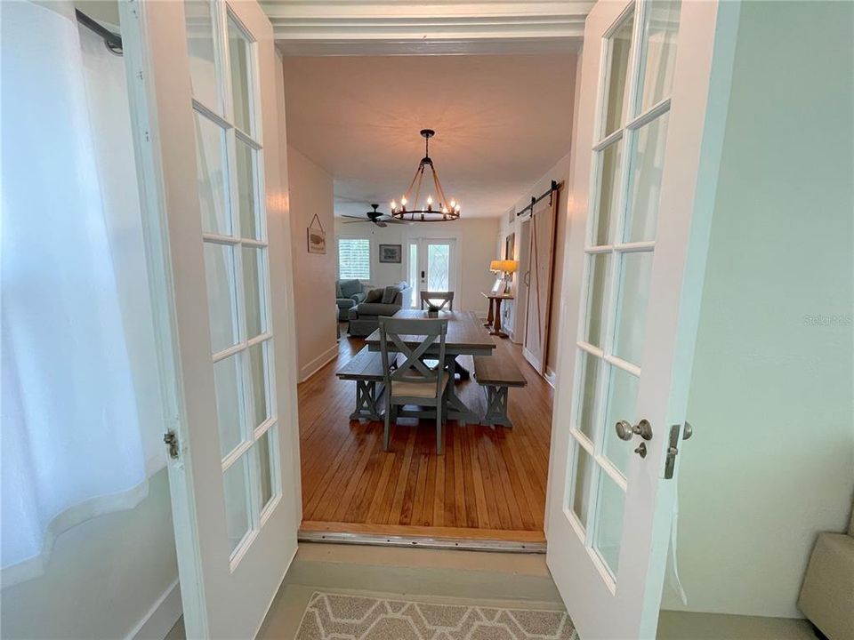 Quaint French doors lead out to the sunroom!