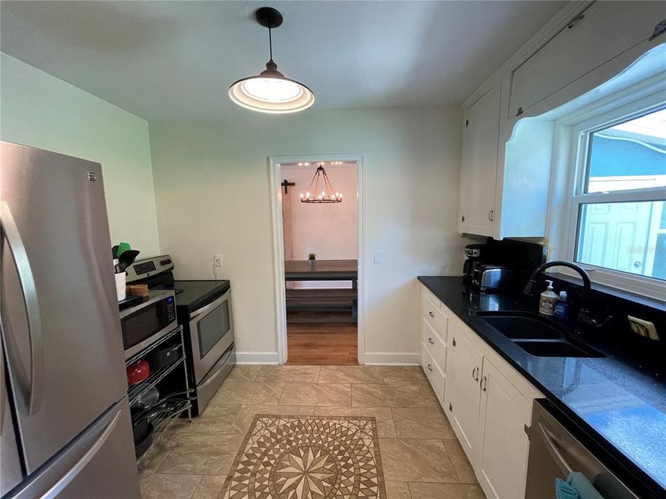 Spacious galley kitchen has microwave, dishwasher and full size fridge and stove!