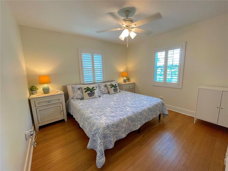 Large primary bedroom has king size bed, storage and walk in closet!