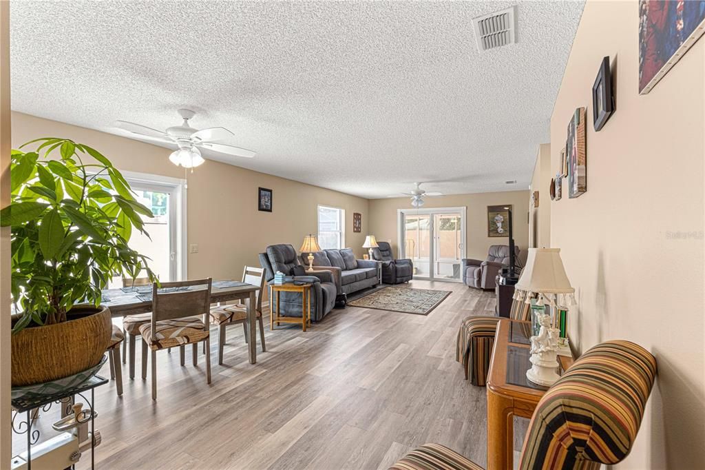 ANOTHER VIEW OF THE LIVING ROOM AND DINING ROOM