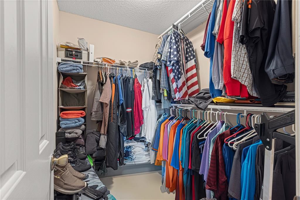 PRIMARY WALK IN CLOSET WITH LOTS OF STORAGE SPACE