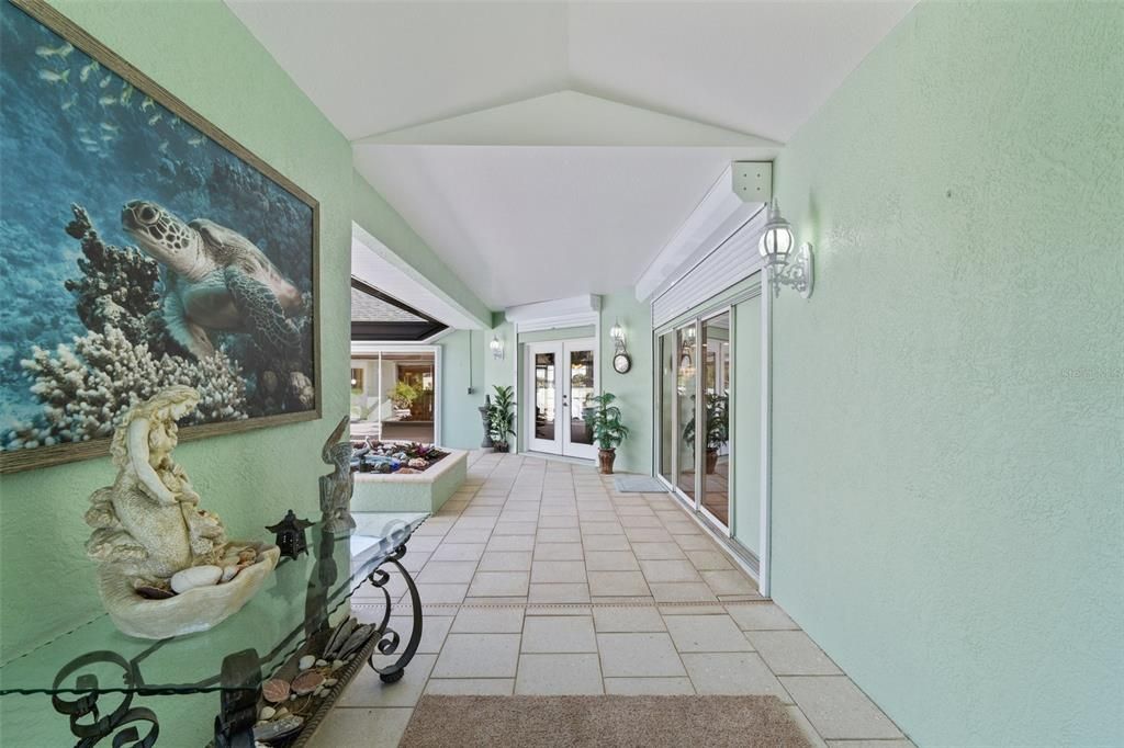 Front door entrance leads directly into courtyard pool patio with Cabana (In-law suite)