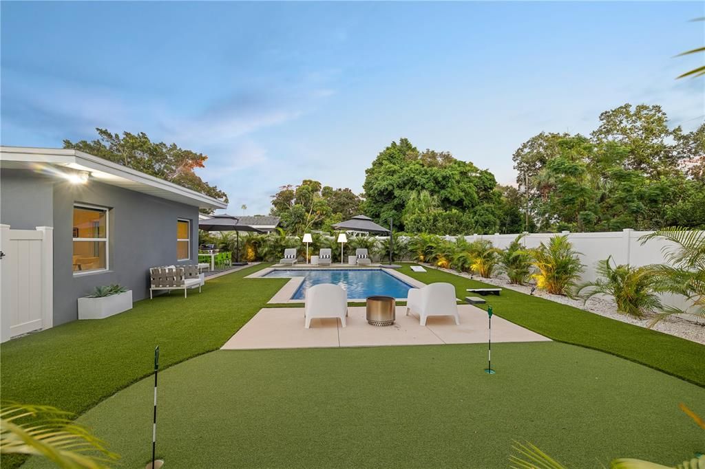 Pool area with a small putting green