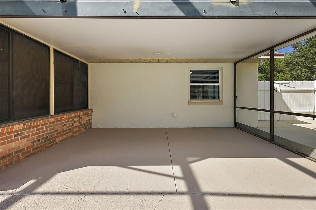 Patio inside the pool enclosure; this is in addition to the screened lanai!