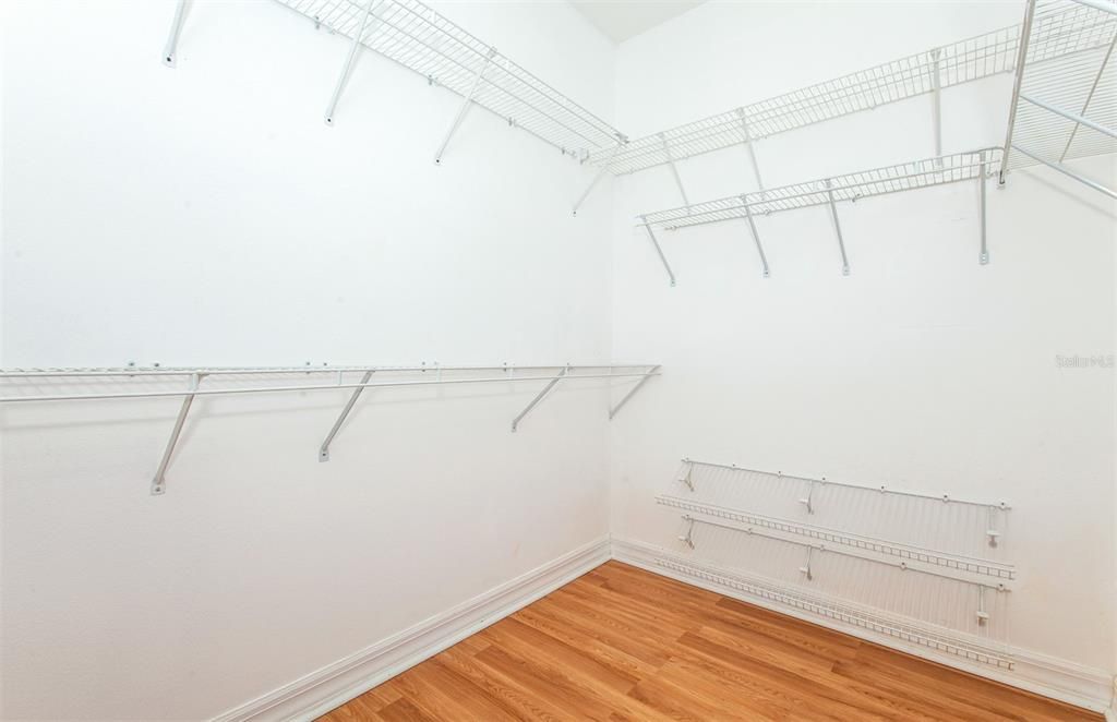 Primary bedroom walk in closet