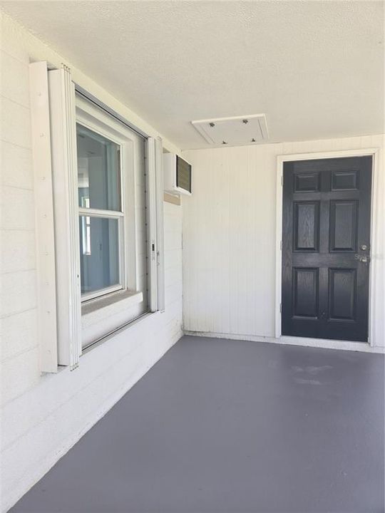 carport and door to laundry room- from inside you can access the home