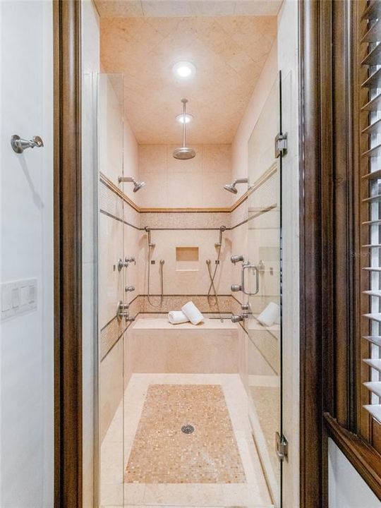 Walk-in Shower with multiple shower heads, rain head, body sprays