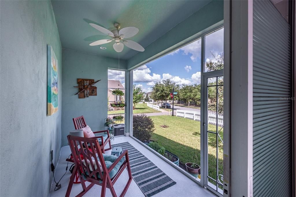 This extended covered & screened side porch looks into an oversized private side yard taking advantage of the corner lot where you can entertain and unwind in style.