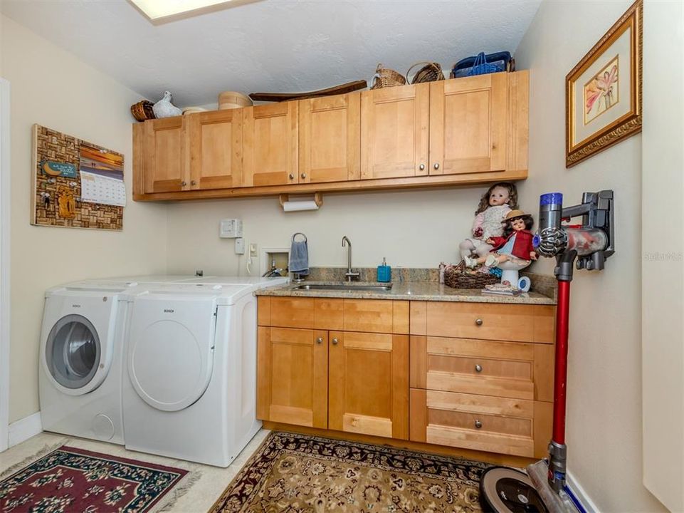 Laundry room with extra storage.