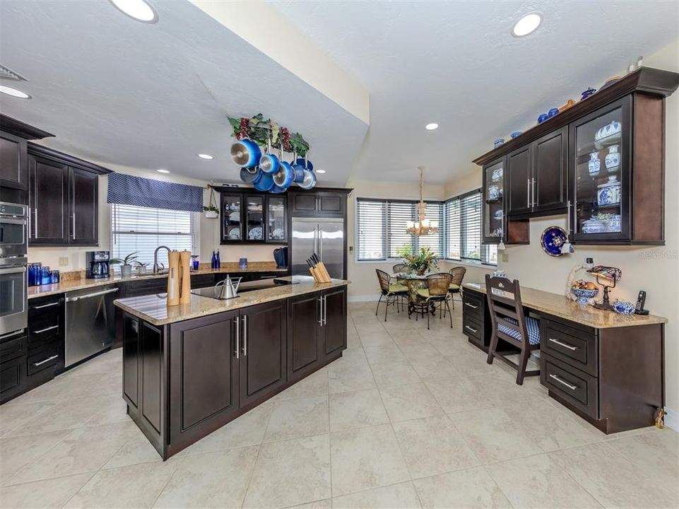 This chef’s kitchen is sure to delight, featuring top-of-the-line appliances that promise exceptional performance.