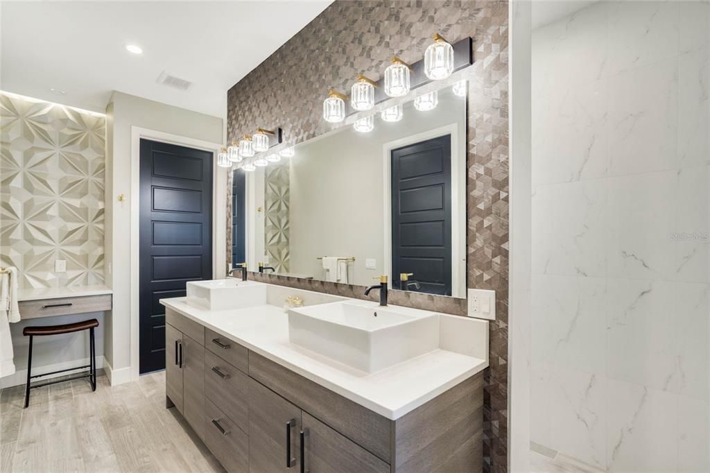 Primary bath with dual vanity and walk through "carwash" overhead rain shower.