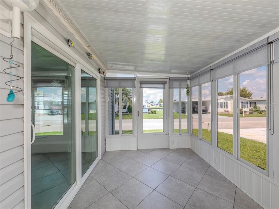 Florida room with acrylic sliding windows and Levolor blinds.