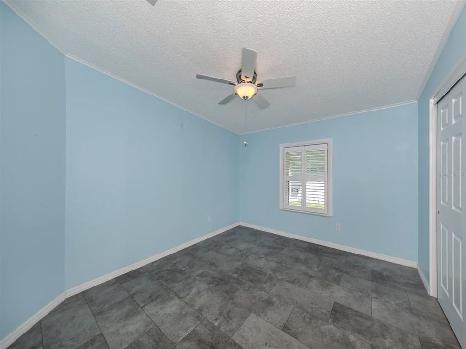 Guest bedroom with built-in closet.