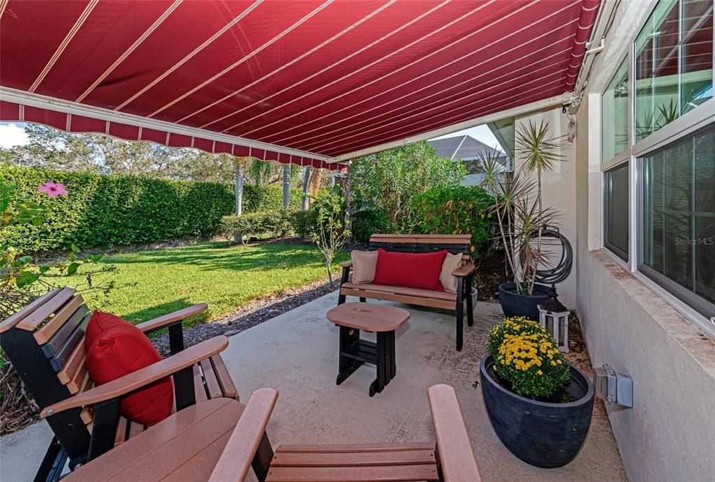 Patio with retractable awning with built in lighting